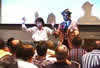 Buford onstage with sales meeting participant